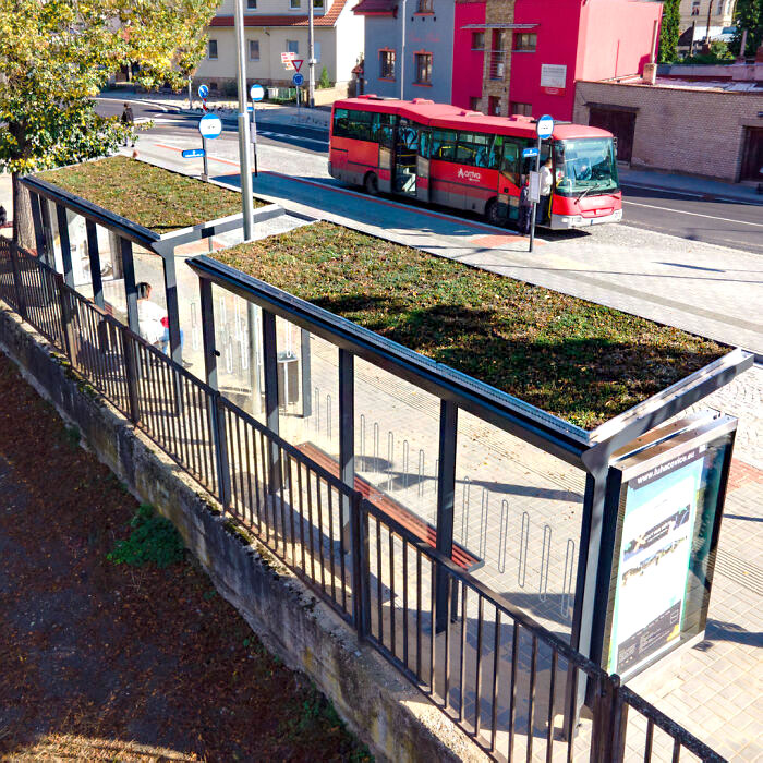 Green Roofs Contribute to Reducing Ambient Dust and Improving the Microclimate in Urbanized Areas Lacking Green Space