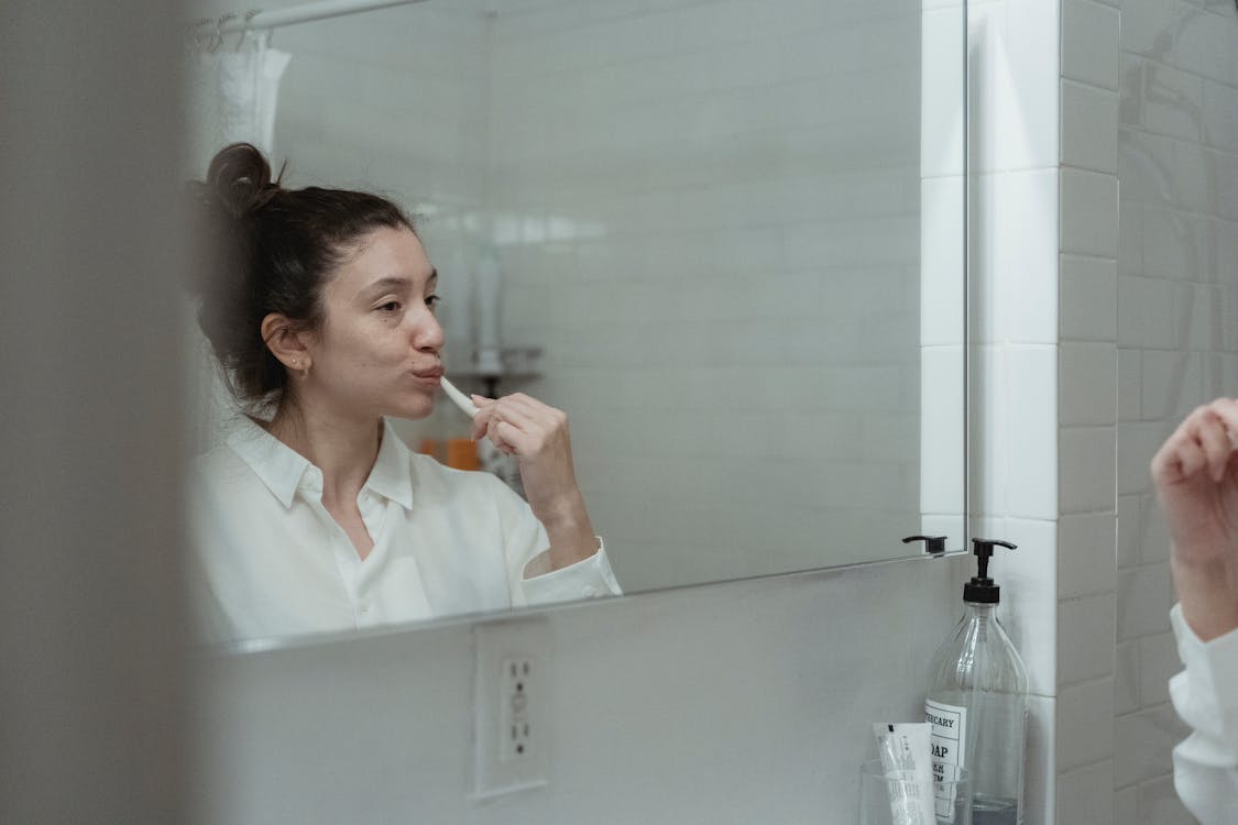 Free Woman Brushing Teeth Stock Photo